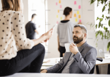 demo-attachment-470-business-people-with-wheelchair-in-the-office-P9M4RX3